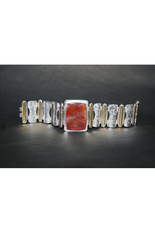 Hinged bracelet of sterling silver, 22k gold and plume agate.