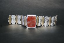 Hinged bracelet of sterling silver, 22k gold and plume agate.