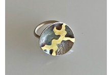 Silver and gold ring with patina.